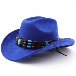 Detail of royal blue suede cowboy hat featuring turquoise bead band and vintage metal accent