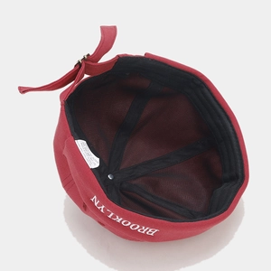 Deep red cotton docker hat with Brooklyn embroidery and adjustable metal buckle