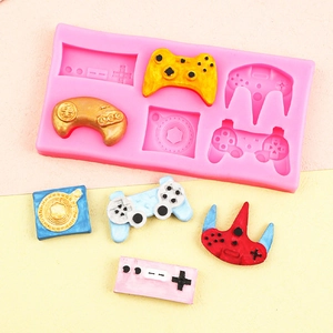Pink silicone game controller mold with colorful resin gamepad charms for DIY crafts
