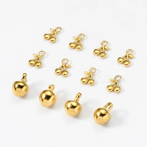 Golden titanium steel 18k cherry and apple fruit pendants on white background