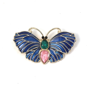 Broche papillon vintage dorée avec émail bleu et pierres précieuses colorées