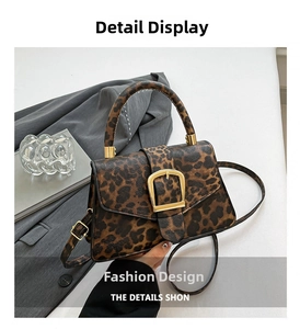 Detail of leopard print crossbody bag with vintage golden metal buckle and textured finish