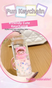 Detailed close-up of a liquid quicksand bottle keychain with a cute pink cat girl figure