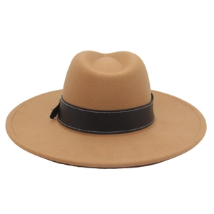 Close-up of camel felt fedora with a black leather band and detailed white stitching
