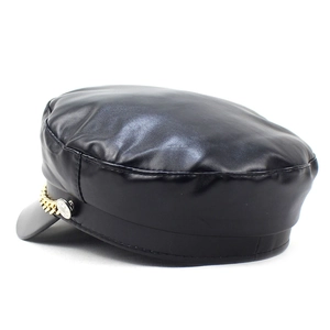 Detail shot of black PU leather baker boy hat with gold chain and metal button accents