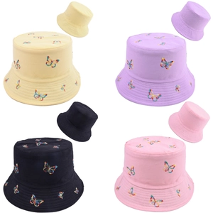 Pack of four colorful reversible bucket hats with rainbow butterfly embroidery details