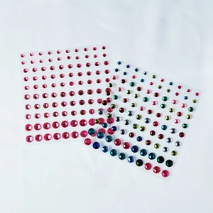 Close-up of pink and mixed color self-adhesive face rhinestones in various sizes
