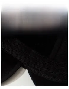 Macro shot of the widened sweatband with breathable texture on a black winter baseball cap