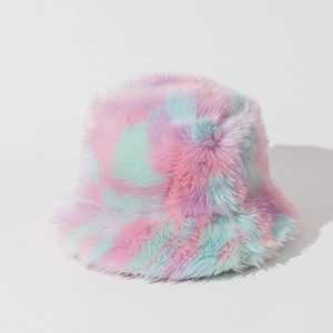 Close-up of tie-dye plush bucket hat showing soft pink, blue, and purple faux fur textures