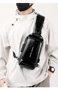 Detail of waterproof black leather chest bag with USB charging port and anti-theft lock