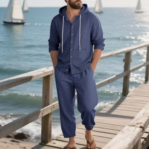 Detail of blue linen casual set for men showing beach holiday outfit with hooded shirt
