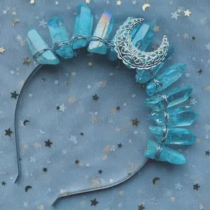 Detailed view of blue crystal stones and silver moon ornament on handmade headband