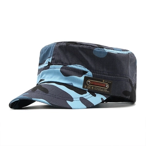 Close-up of blue camo patrol cap showing the leather brand label and cotton twill texture