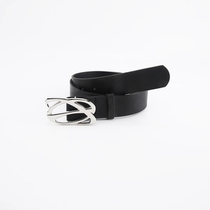 Detail of black leather belt with silver irregular metal buckle on white background
