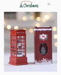 Close-up of red Christmas telephone booth LED light with Santa Claus and festive gift box