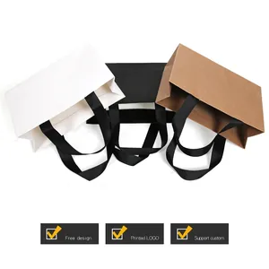 Thick kraft paper gift bags with wide ribbon handles in white black and brown colors