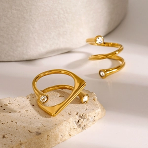 Three-layer spiral and geometric gold rings with cubic zirconia on stone base