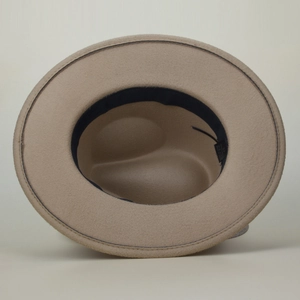 Detail view of khaki wool felt jazz hat interior featuring sweatband and size label