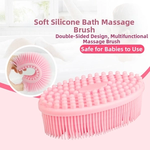 Pink dual-sided silicone baby bath brush with soft bristles and massaging nodes