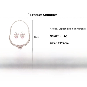 Detail view of zircon bow jewelry set showing necklace dimensions and copper material texture