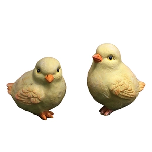 Pair of realistic resin baby chick figurines with detailed feather texture and orange beaks