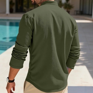 Men's waffle knit army green polo shirt shown from a back view in an outdoor setting