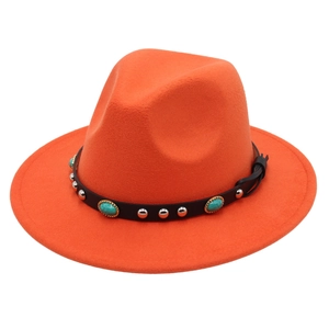 Detail of bright orange wool fedora with turquoise and silver studded leather band