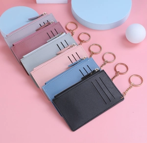 Close-up of litchi texture leather card holders in six colors with gold zipper and keychain