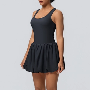 Detail of black sports dress featuring pleated skirt and racerback athletic design