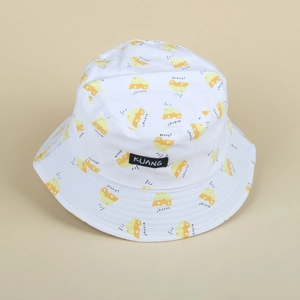 White cotton bucket hat featuring yellow cartoon cheese patterns and black logo patch