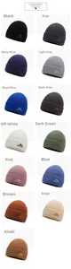 Collection of knitted winter beanies in various colors for outdoor sports