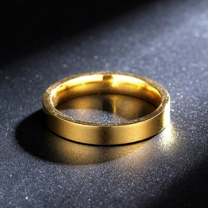 3mm minimalist gold titanium steel ring with brushed matte finish on dark background