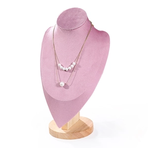 Pink velvet necklace display stand with round wooden base for jewelry showcase
