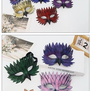 Detailed view of colorful masquerade masks with intricate feather and leather textures
