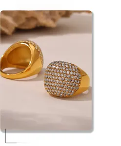 Detail of 18K gold plated wide rings featuring luxurious full pave zircon setting