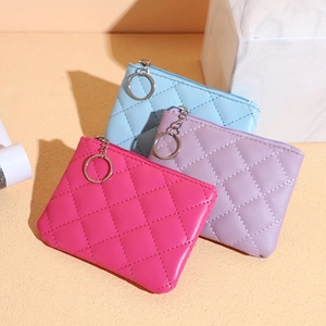 Detailed view of quilted PU leather mini wallets in rose, purple, and blue with keychains