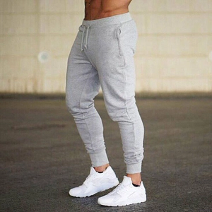 Slim fit men's light grey joggers with drawstring waist and side pockets for outdoor fitness