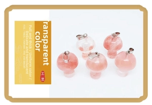 Detail of five rose quartz mushroom pendants with silver metal clasps and translucent pink texture