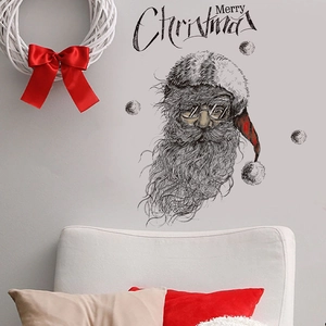Christmas Santa wall sticker with Merry Christmas typography on white wall over sofa