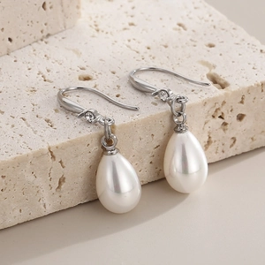 Boucles d'oreilles élégantes en perles de goutte avec petits cristaux sur socle pierre