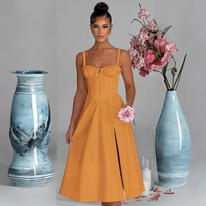 Detail of ginger yellow slim fit midi dress featuring front tie-up and side slit design