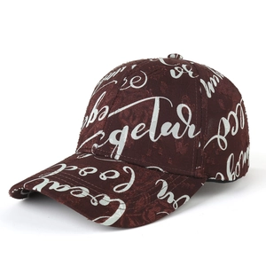 Unisex structured burgundy baseball cap with white graffiti text and textured fabric