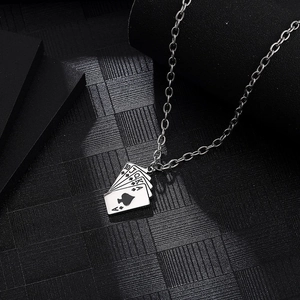 Detailed view of silver poker flush pendant featuring spades 10 to Ace on black texture