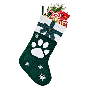 Detail of green velvet pet Christmas stocking with white knit cuff and embroidered cat paw