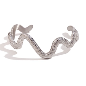 Silver hammered wave bangle with textured open design in polished stainless steel