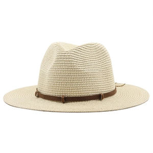 Vintage western straw cowboy hat with brown leather band and metal buckle detail