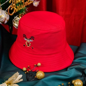 Festive red bucket hat with reindeer embroidery and Christmas theme decorations