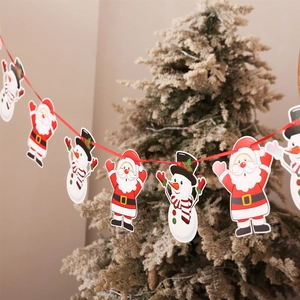 Christmas banner featuring cartoon Santa Claus and Snowman hanging on a festive tree