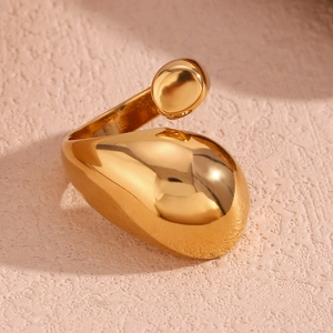 Detail of 18K gold plated teardrop ring with hammered texture and open band design