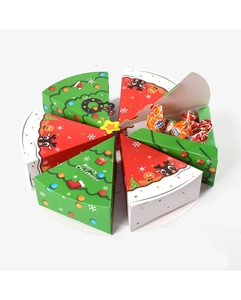 Close-up of red and green Christmas tree slice candy boxes with festive Merry Christmas motifs
